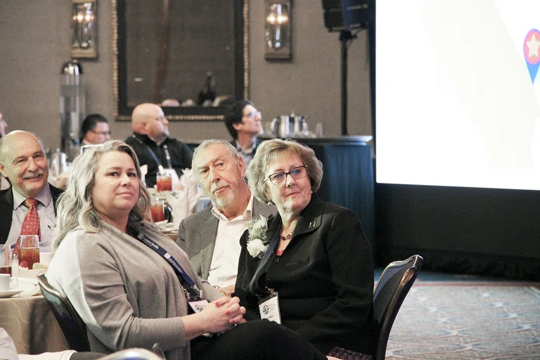 Retiring Needles USD Superintendent Mary McNeil, far right, and Jon McNeil, center.