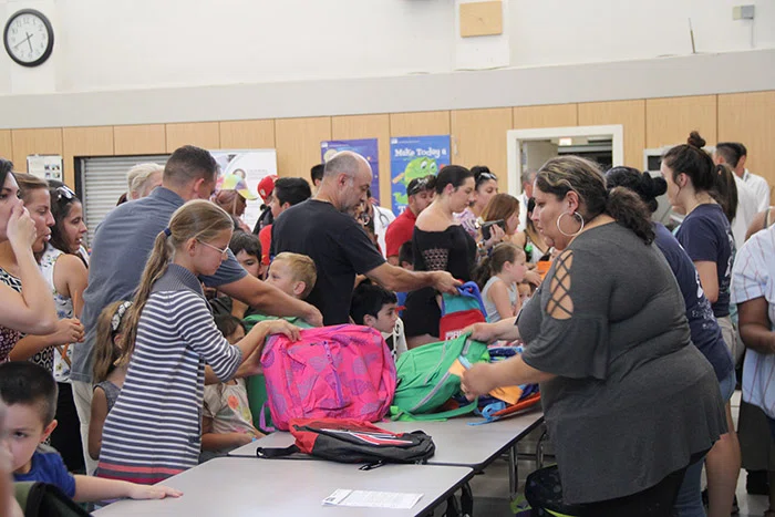 Students received free backpacks with school supplies.
