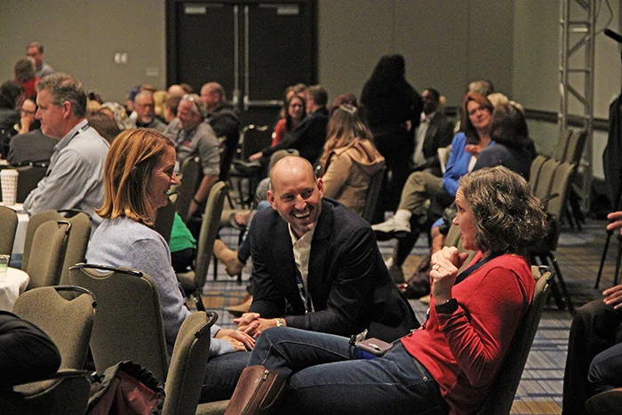 Attendees discuss a topic during Roni Habib’s keynote.
