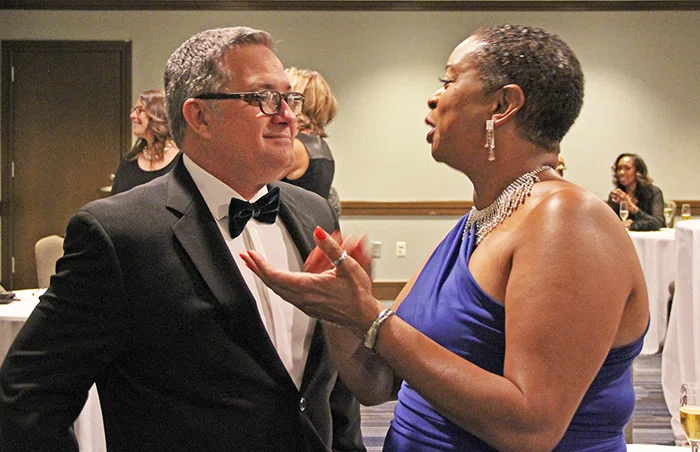 ACSA Executive Director Wes Smith chats with Valuing Diversity Award winner Michele Bowers.