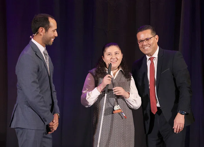 Edgar Zazueta, left, and Rafael Plascencia, right, with Region 10 student Mariana Cortes-Ceja.