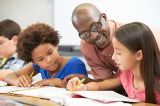 Black_male_teacher_with_kids.jpg