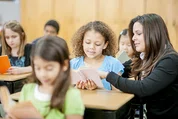 Teacher and students in classroom.
