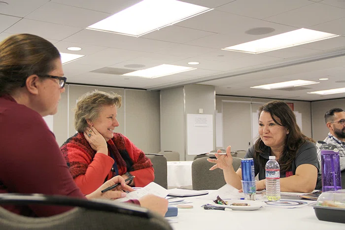 Attendees discuss social emotional learning during a preconference to Summit.