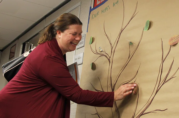 Preconference attendees placed a leaf on a tree with an SEL commitment written on it.