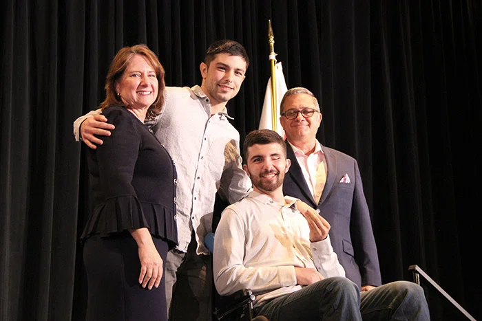 Every Student Succeeding winner Keannu Linnell poses with Linda Kaminski and Wes Smith.