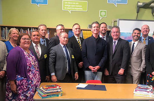 Gov. Gavin Newsom signing AB48.