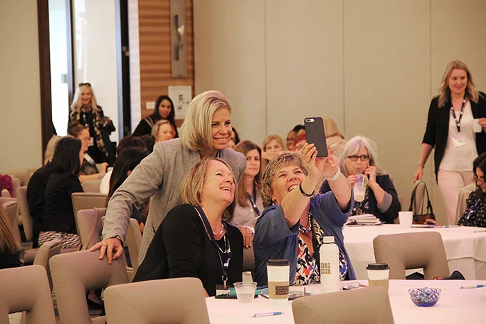 Attendees take selfies and tag them with #LadiesWhoLead.