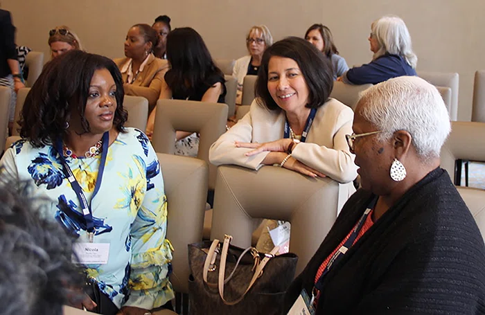At center, Irella Perez, WLF planning committee member, listens to participants.