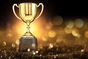 Award cup against dark background.