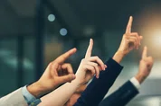 Hands raised in the air.