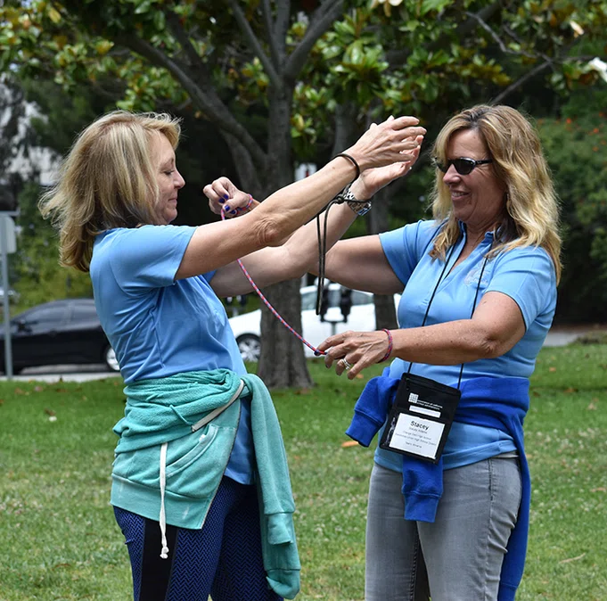 Principals work together to untie a knot.