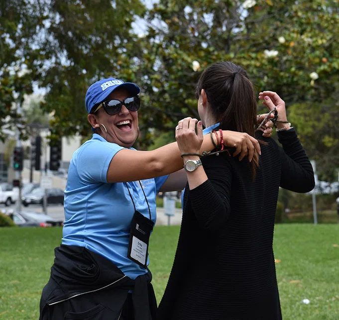 Principals work together to untie a knot.