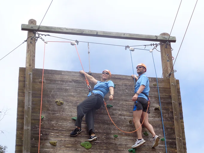 Principals on the ropes course.