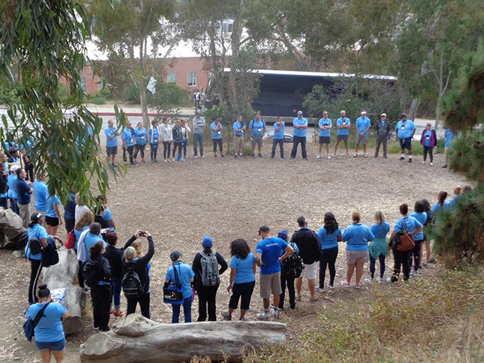 Principals form a group circle.
