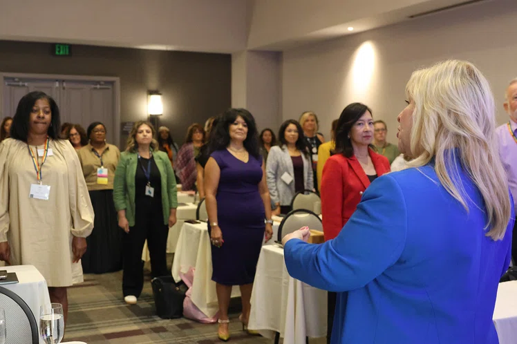 Dr. Benita Scheckel leads attendees in vocal exercises.