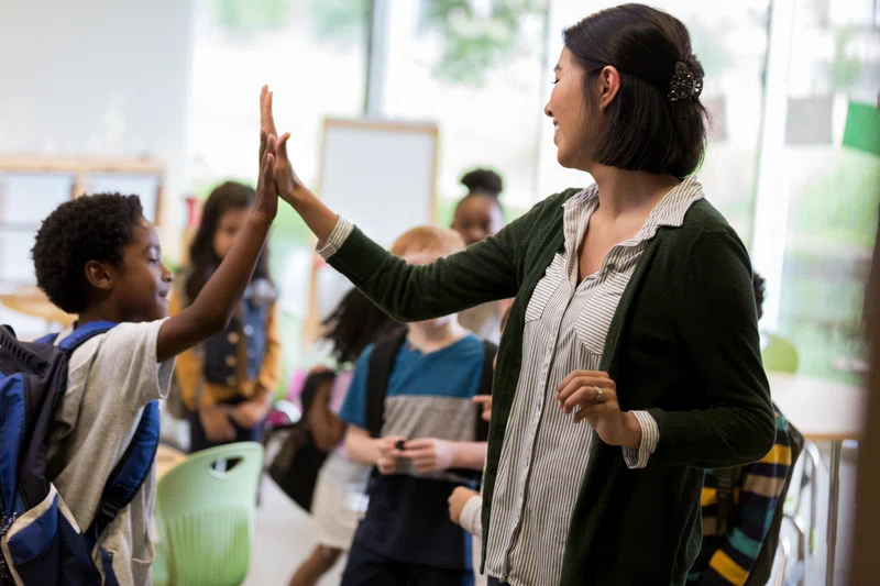 Student_teacher_high-five.webp
