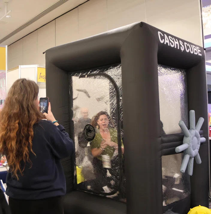 Visitors to the Member Services Lounge could win fake money in the “Cash Cube.”