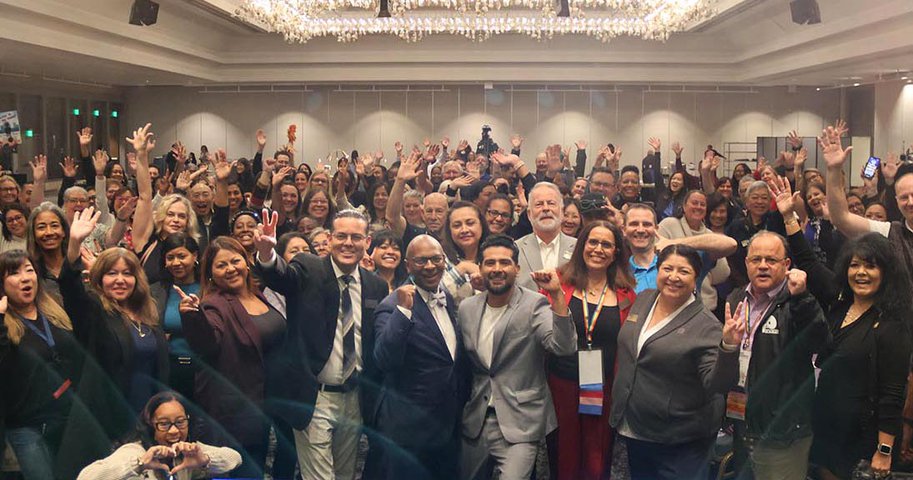 Attendees at the Leadership Summit pose for a photo with keynote Dr. Victor Rios.