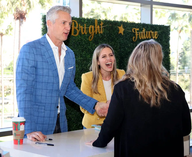 Attendees chat with The Holderness Family during a book signing after their keynote.
