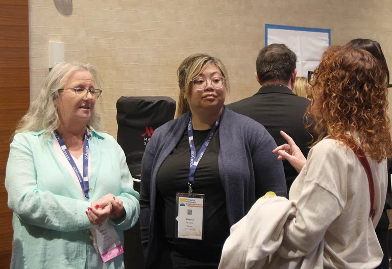 Attendees break out into groups for an activity.