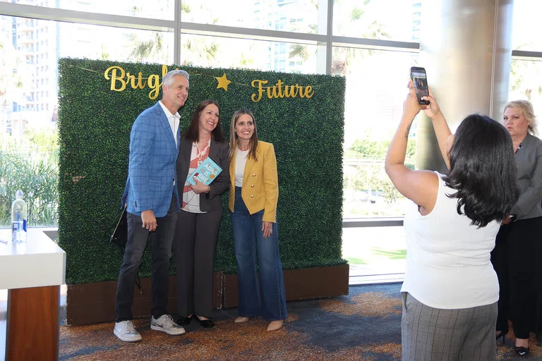 Attendees take a picture with The Holderness Family during a book signing.