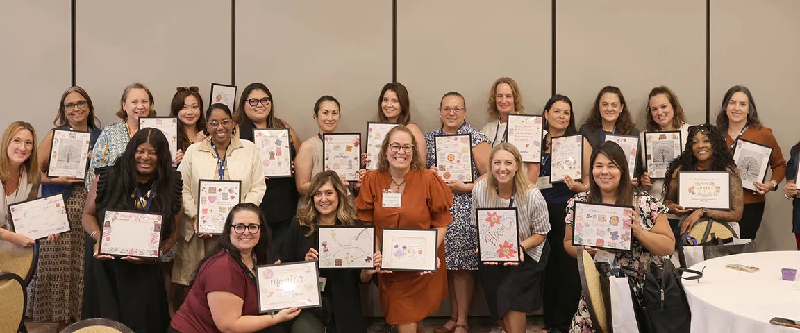 Participants proudly display their completed vision boards.