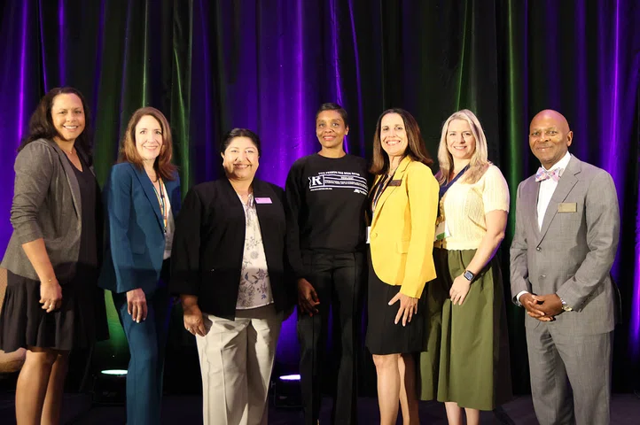 Dr. Shree Walker (center) gathers with attendees following her keynote address.