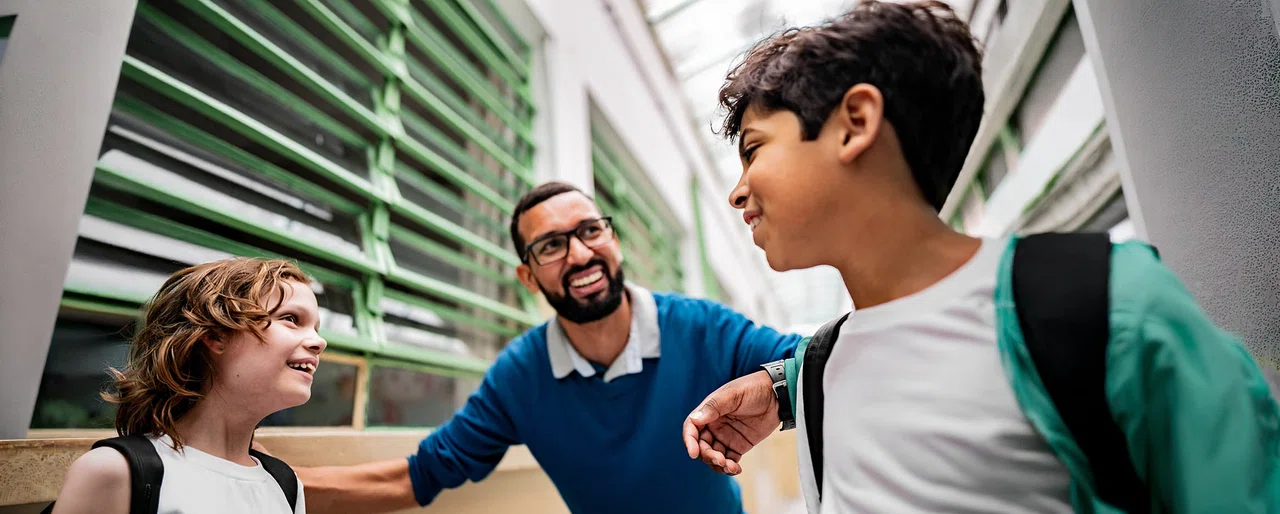 male_elem_principal_with_students_WIDE.jpg