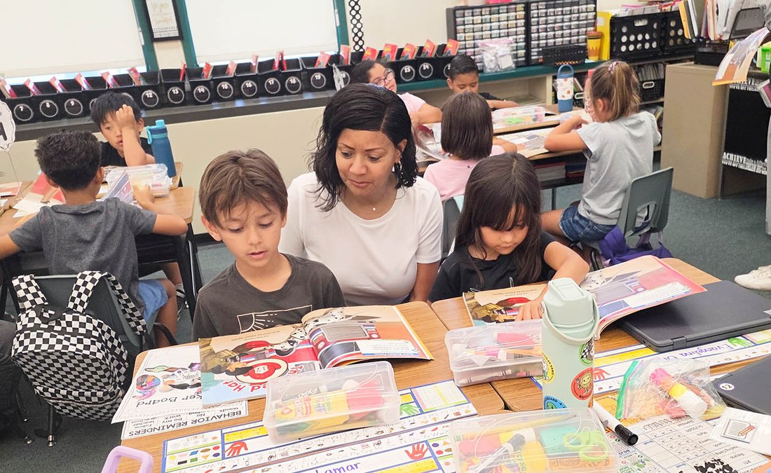 AOY_Hendricks-Brown_Listening_to_students_read.jpg
