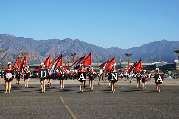 Drum majorettes at Dana Middle School with mountains in the background.