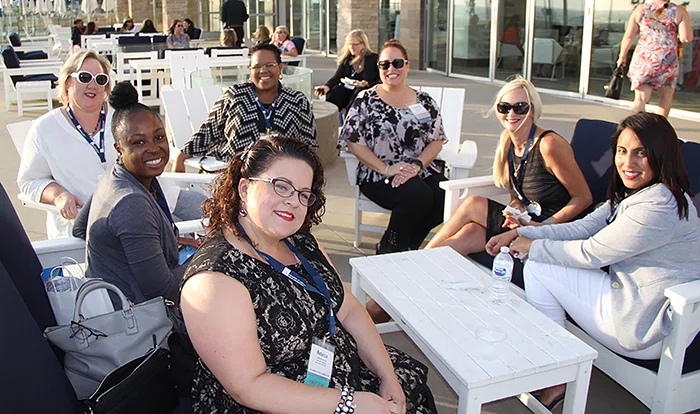 Attendees enjoy the terrace at the Paséa Hotel & Spa during the welcome reception.