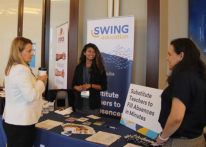 Attendees chat with exhibitors at the 2019 Women in School Leadership Forum.