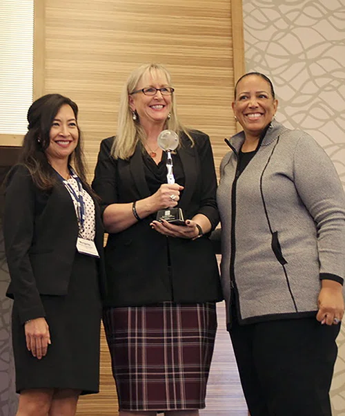 2019 Exemplary Woman in Education winner Cindy Petersen accepts her award.
