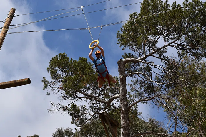 Principal on the ropes course.