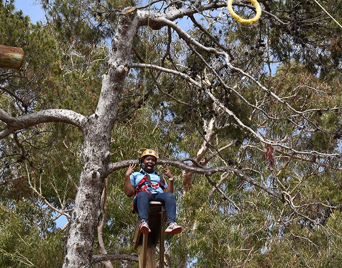Principal on the ropes course.