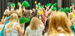 Districts wave pom poms at the CEL Fall Dinner. 